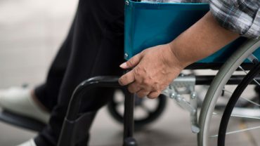 Close up of a senior woman sitting in a wheelchair